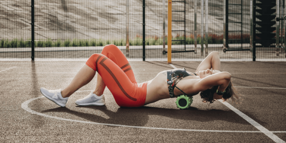 woman foam rolling for mid back pain