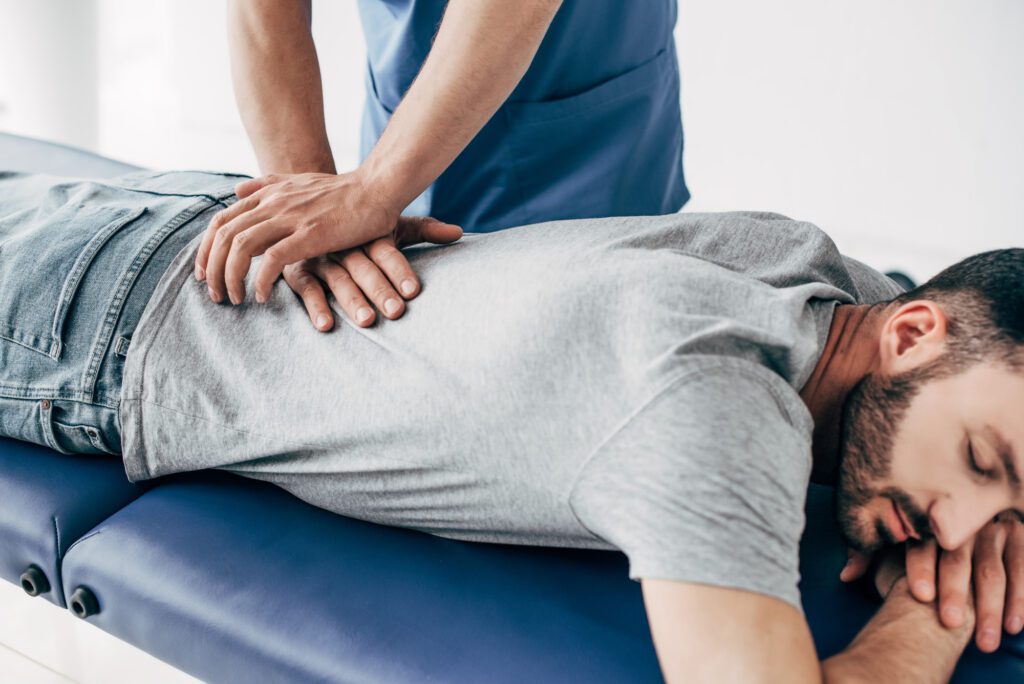 patient laying on chiropractic table